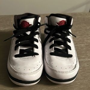 Nike Toddler Jordan’s in White, Red, and Black.